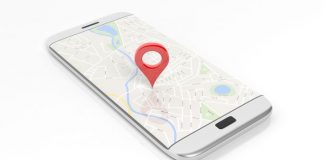 Smartphone with map and red pinpoint on screen, isolated on white background.