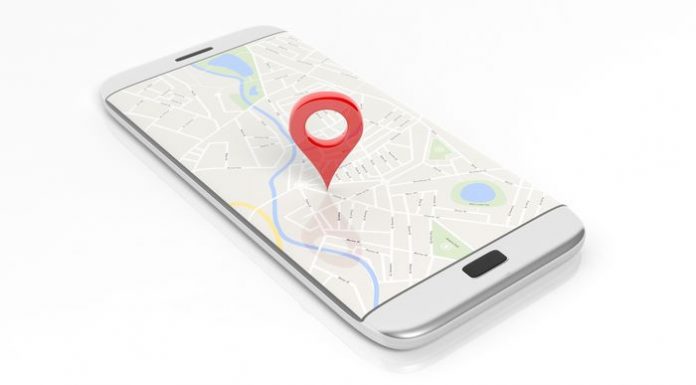 Smartphone with map and red pinpoint on screen, isolated on white background.