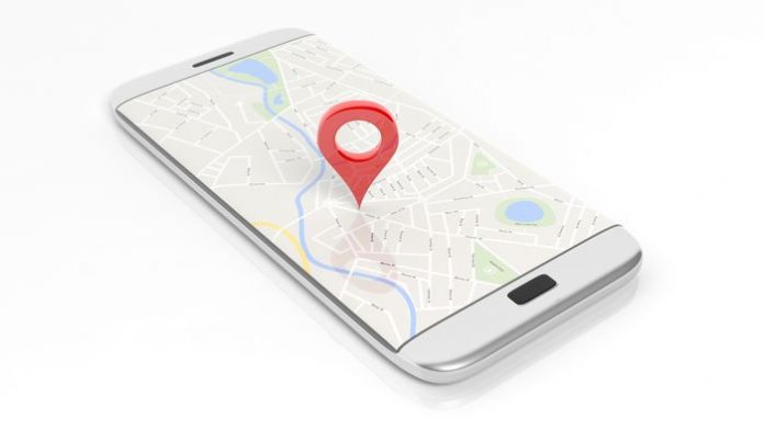 Smartphone with map and red pinpoint on screen, isolated on white background.