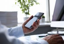 Businessman hipster holds telephone background