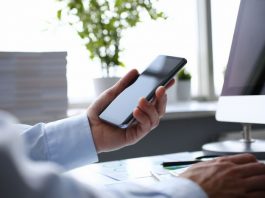 Businessman hipster holds telephone background