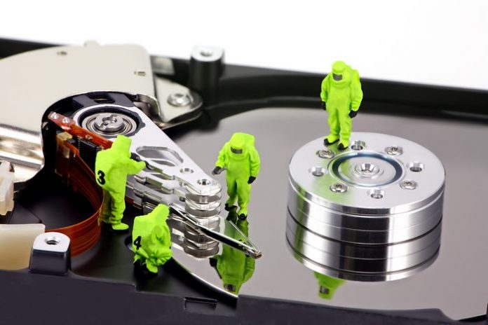 hazmat team inspecting a hard drive